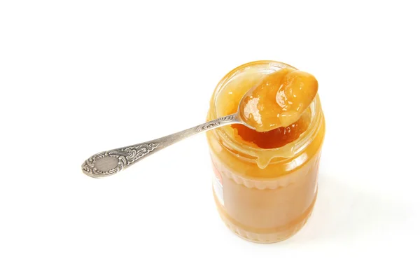 Мед в банці з ложкою — стокове фото