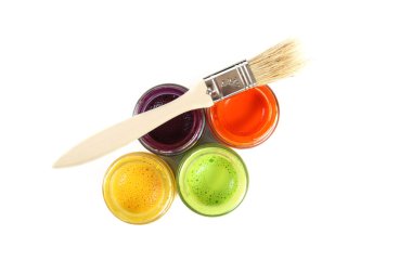 Colorful paint buckets with paintbrush on white background clipart