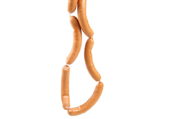 Bunch of sausages hanging over white background — 스톡 사진