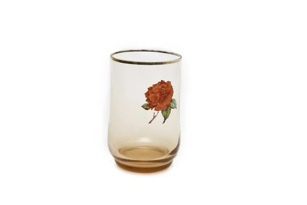 With a glass of rose decoration on white background — Stock Photo, Image