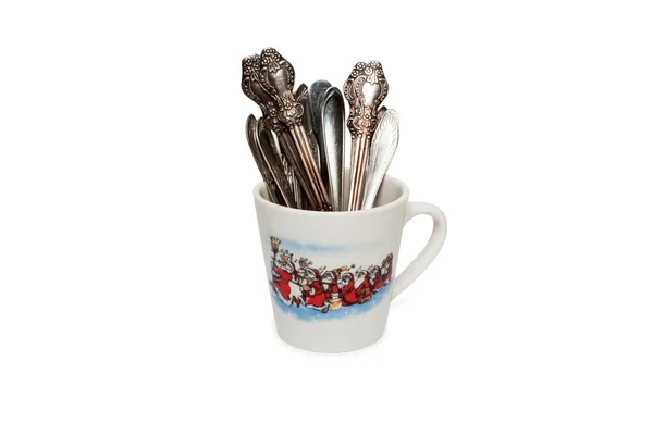 With a cup of tea spoons on a white background — Stock Photo, Image