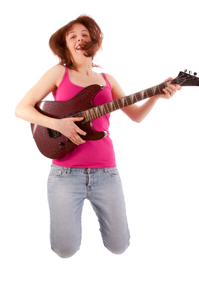A beautiful young woman is playing a guitar