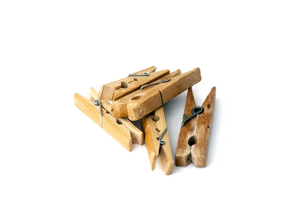 Pile of wooden clothespins isolated on white — Stock Photo, Image