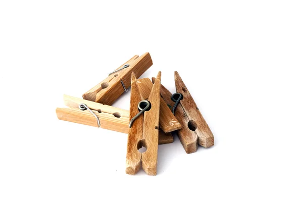 Pile of wooden clothespins isolated on white — Stock Photo, Image
