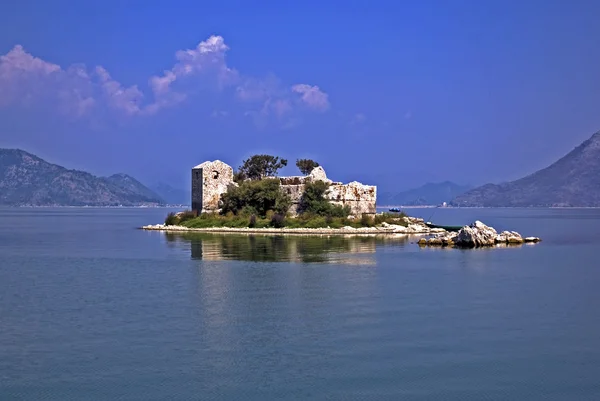 Stock image Island with the ruined building