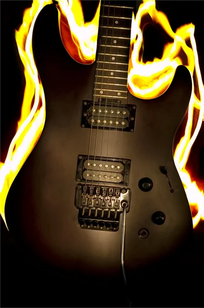 stock image Burn guitar on the black background