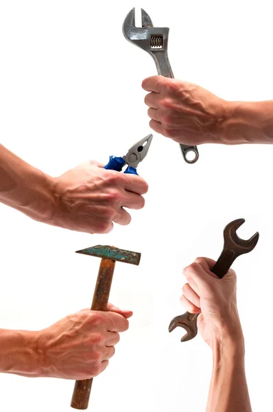 Quatro mãos com vários equipamentos — Fotografia de Stock