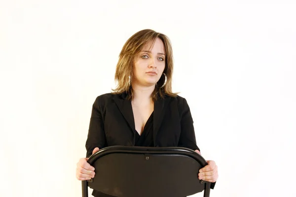 Mujer joven de negocios sentada en una silla —  Fotos de Stock