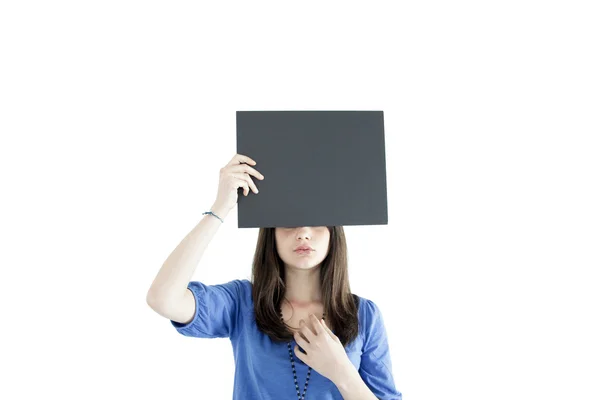 A girl masking her eyes with a board — Stock Photo, Image