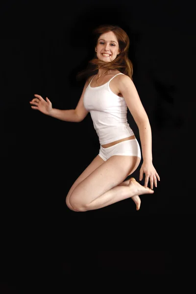 Jumping underwear girl — Stock Photo, Image