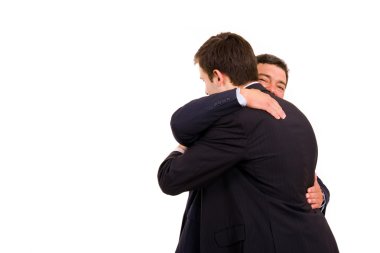 Happy embracing of two business men, isolated on white