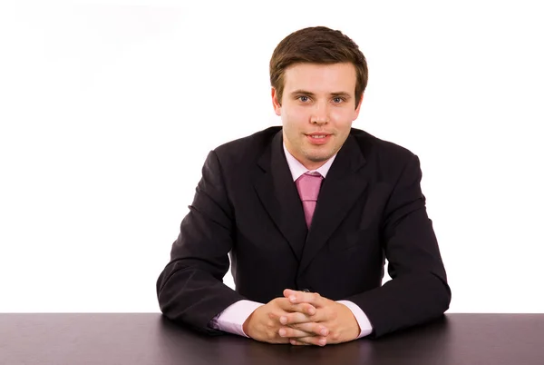 机の上の若いビジネスマン — ストック写真