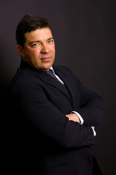 Mature business man portrait on black background — Stock Photo, Image