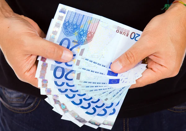Człowiek ręce pokojowe euro rachunki, łapka — Zdjęcie stockowe