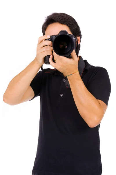 Молодий чоловік фотограф в студії, ізольований на білому — стокове фото