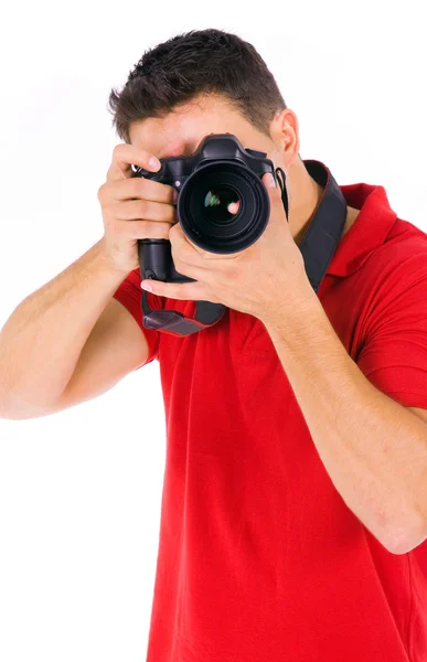 Young male photographer at studio, isolated on white — Stock Photo, Image