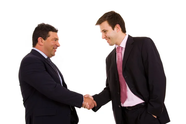 Dois homens de negócios felizes apertando as mãos sobre um fundo branco — Fotografia de Stock