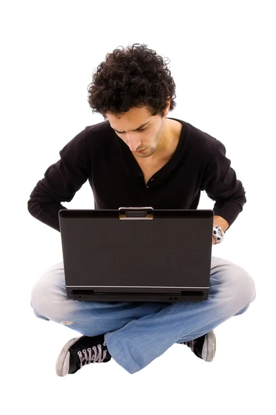 Joven estudiante masculino trabajando con portátil, aislado en blanco — Foto de Stock