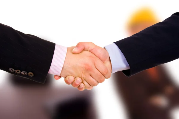 Closeup of business shaking hands at the office — Stock Photo, Image