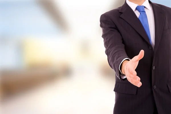 A businessman with an open hand ready to seal a deal at the offi — Stock Photo, Image