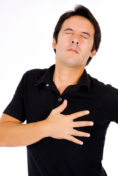 Jonge man lijden van pijn op zijn borst, geïsoleerd op wit — Stockfoto