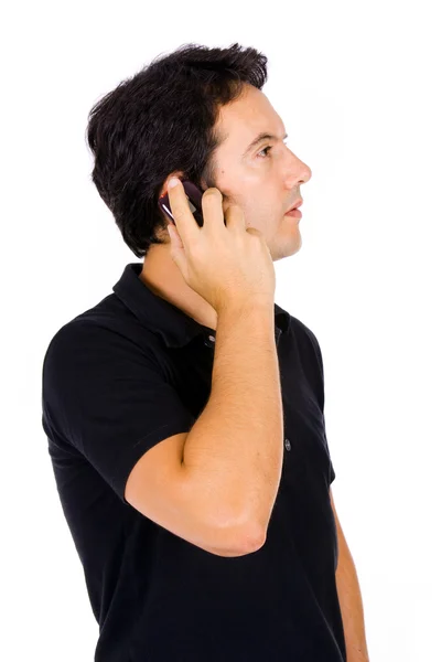 Genç casual adam telefonda üzerinde beyaz izole — Stok fotoğraf