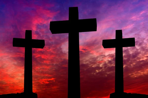 Crosses silhouette over a dramatic sky at sunset — Stock Photo, Image