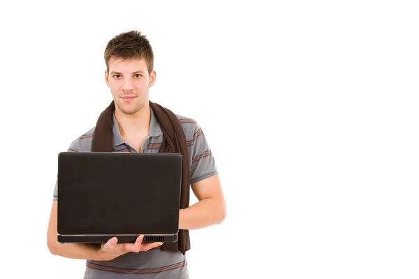 Молодой человек работает с ноутбуком — стоковое фото