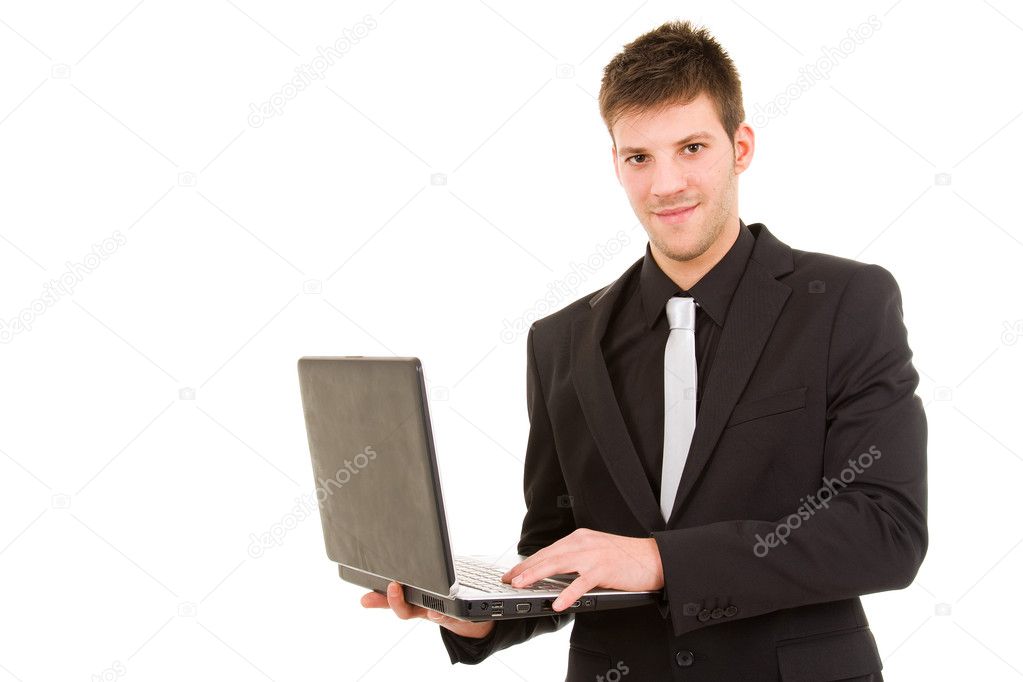 Young business man standing with laptop