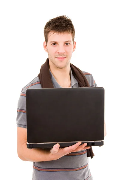 カジュアルな若者ラップトップ コンピューターを持って立っています。wh の分離 — ストック写真