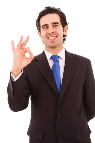 Boldog, fiatal üzleti ember gesztusok ok jele, elszigetelt fehér — Stock Fotó