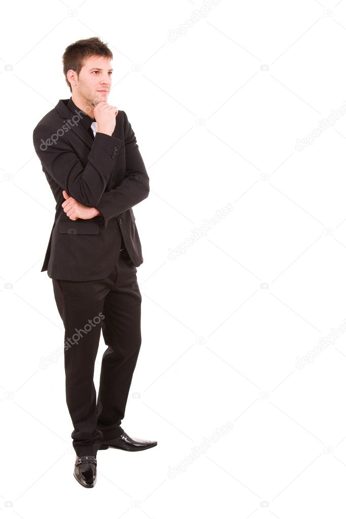 Pensive young business man full body standing against white background