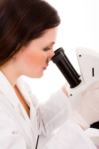 Portrait of medical student looking through microscope in labora — Stock Photo, Image
