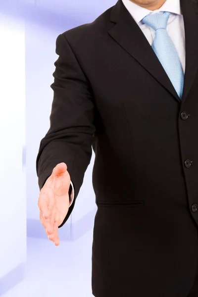 Een zakenman met een open hand klaar om een deal zegel op kantoor — Stockfoto