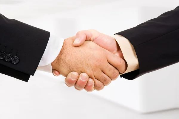 Closeup of business shaking hands at the office — Stock Photo, Image