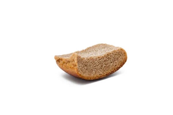 Um pedaço de pão velho sobre um fundo branco — Fotografia de Stock