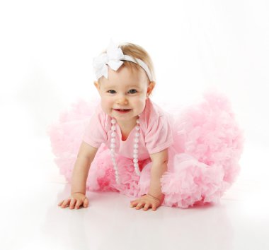 Baby girl wearing pettiskirt tutu and pearls crawling clipart