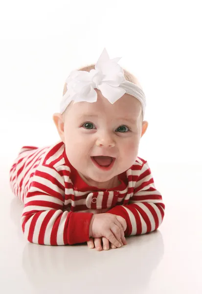 Meisje van de baby in vakantie jammies — Stockfoto