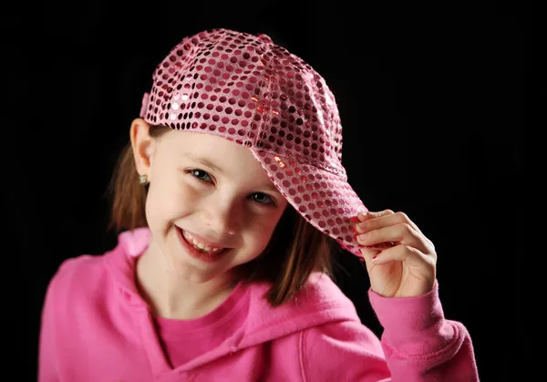 Pembe ışıltılı beyzbol şapkası giyen kadın çocuk — Stok fotoğraf