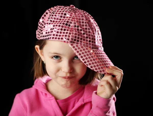 Female child wearing sparkly pink baseball cap — Stockfoto