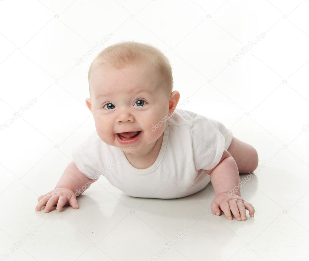 Portrait of a cute young baby wearing a bodysuit shirt lying on belly, on white