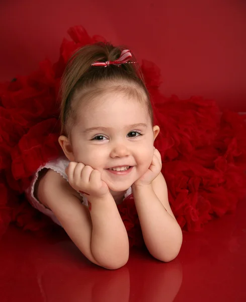 Adorable little girl in red pettiskirt tutu Royalty Free Stock Images