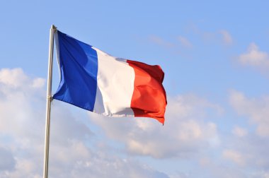 The tricolore or French flag on a summer day. clipart