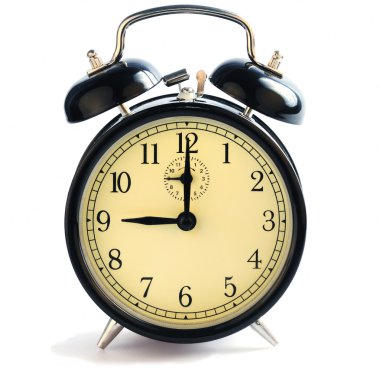 An old-fashioned alarm clock showing nine o'clock. clipart