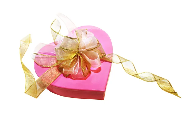 Розовая коробка с золотым луком — стоковое фото