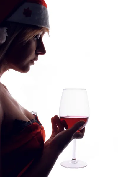 Санта помічник дивлячись на келих червоного вина — стокове фото