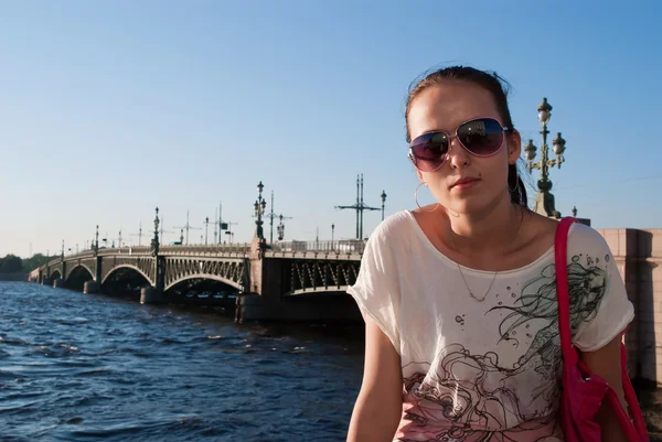 Girl on bridge background — Stock Photo, Image