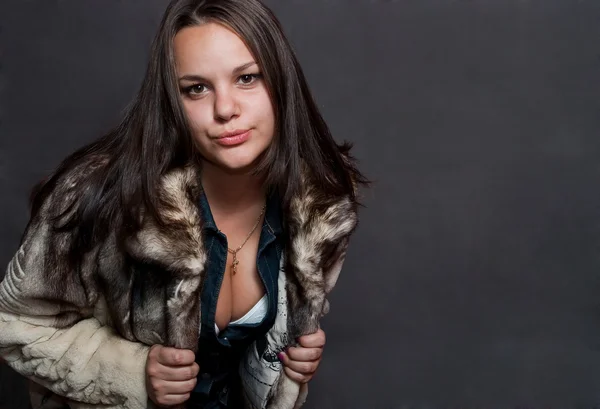 Sexy girl in fur coat — Stock Photo, Image