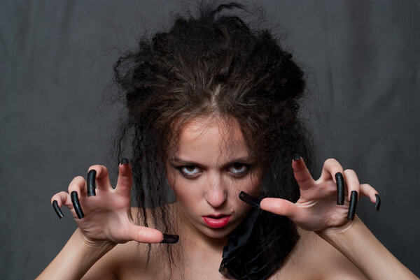 Witch with black nails
