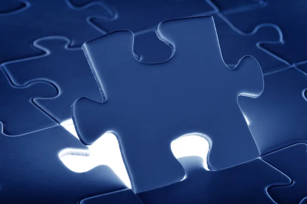 Puzzle piece coming down into it's place — Stock Photo, Image